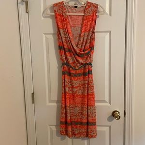 Flattering Anne Klein dress with lovely adjustable aqua gold lion embellishment.